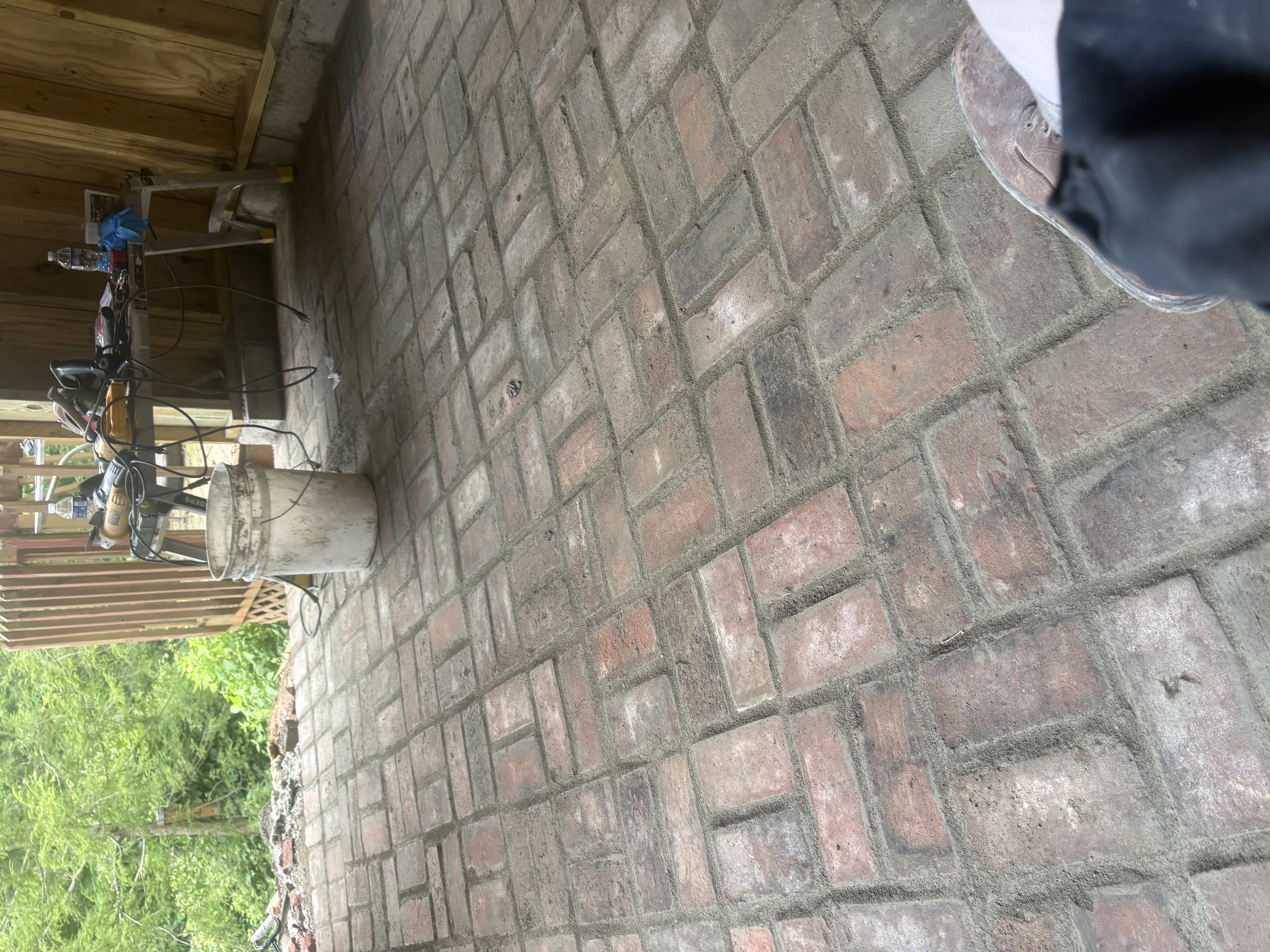 Herringbone brick floor being restored