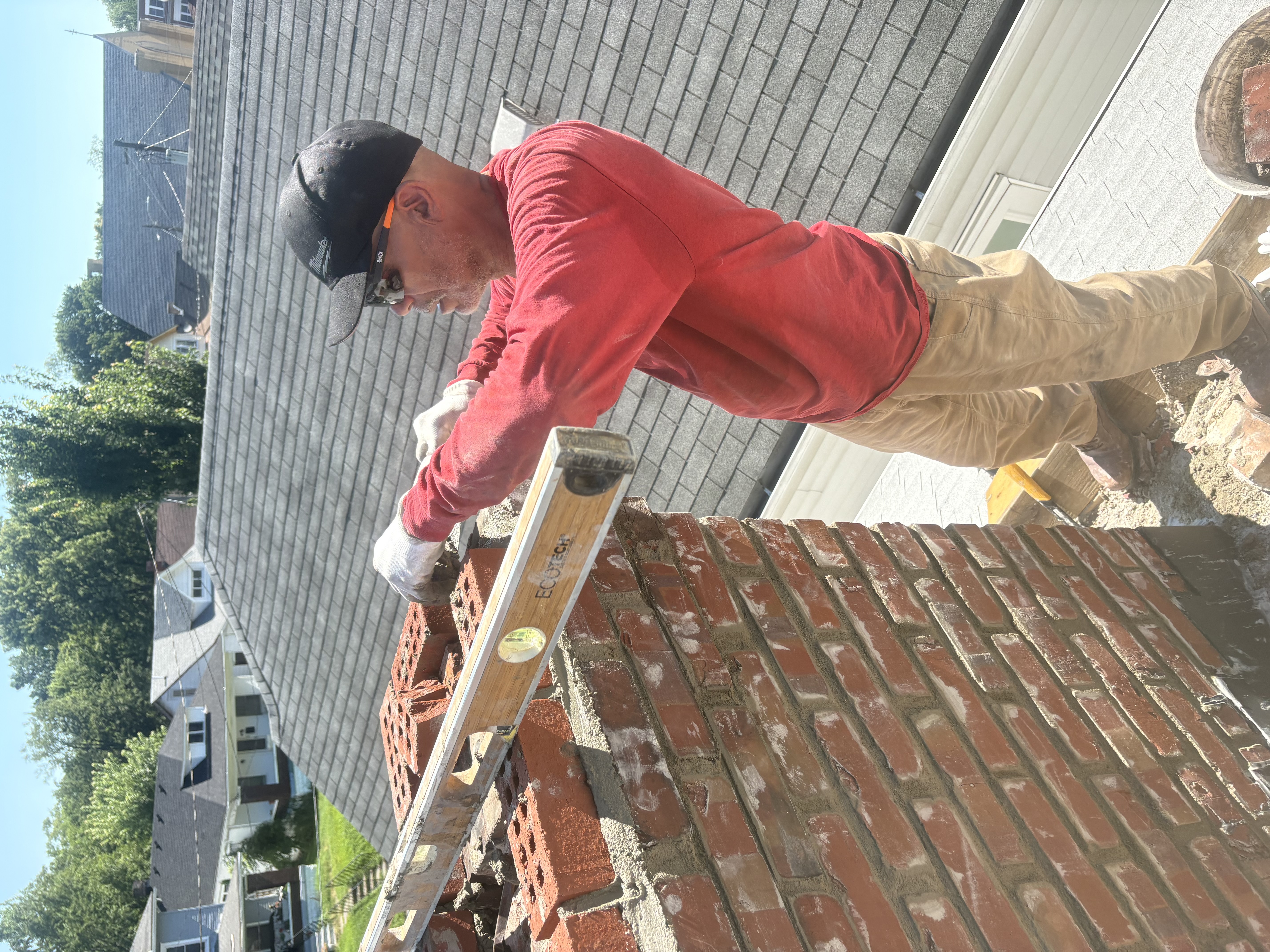 Bob Walker rebuilding a brick chimney